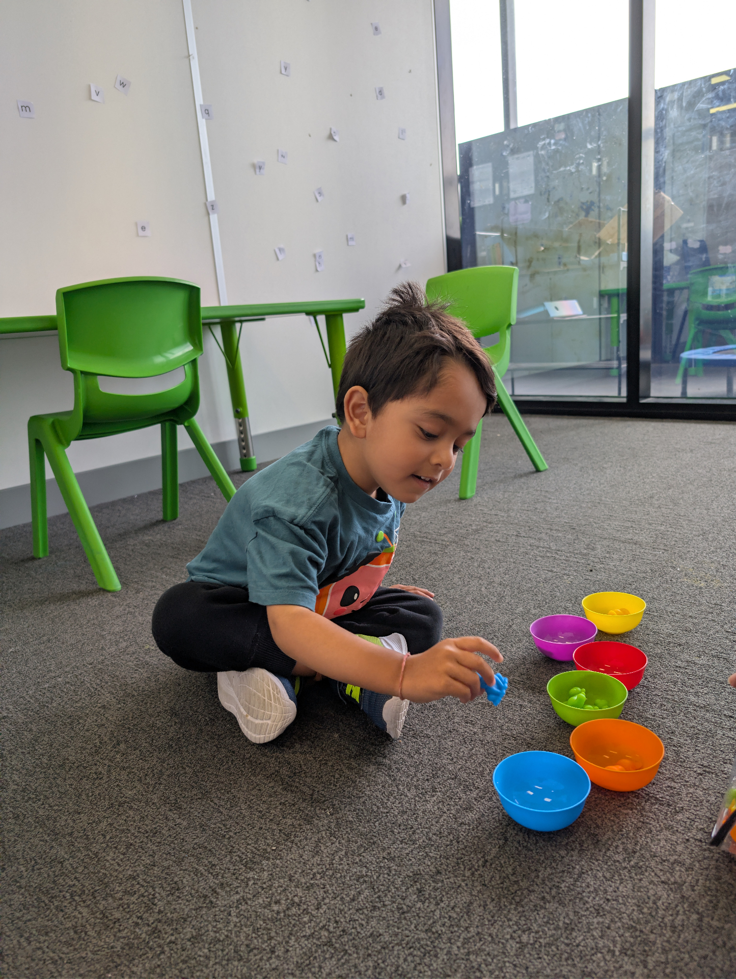 Child shooting basketball for gross motor coordination