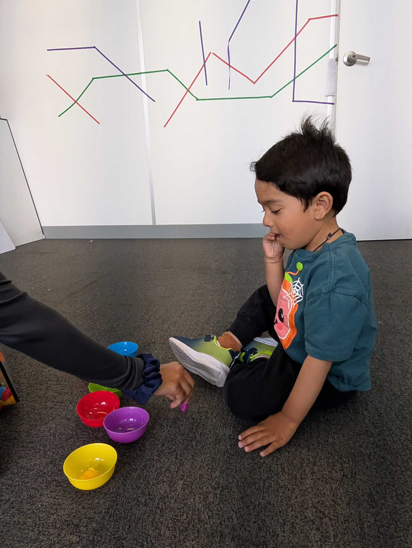 Child sorting colorful objects