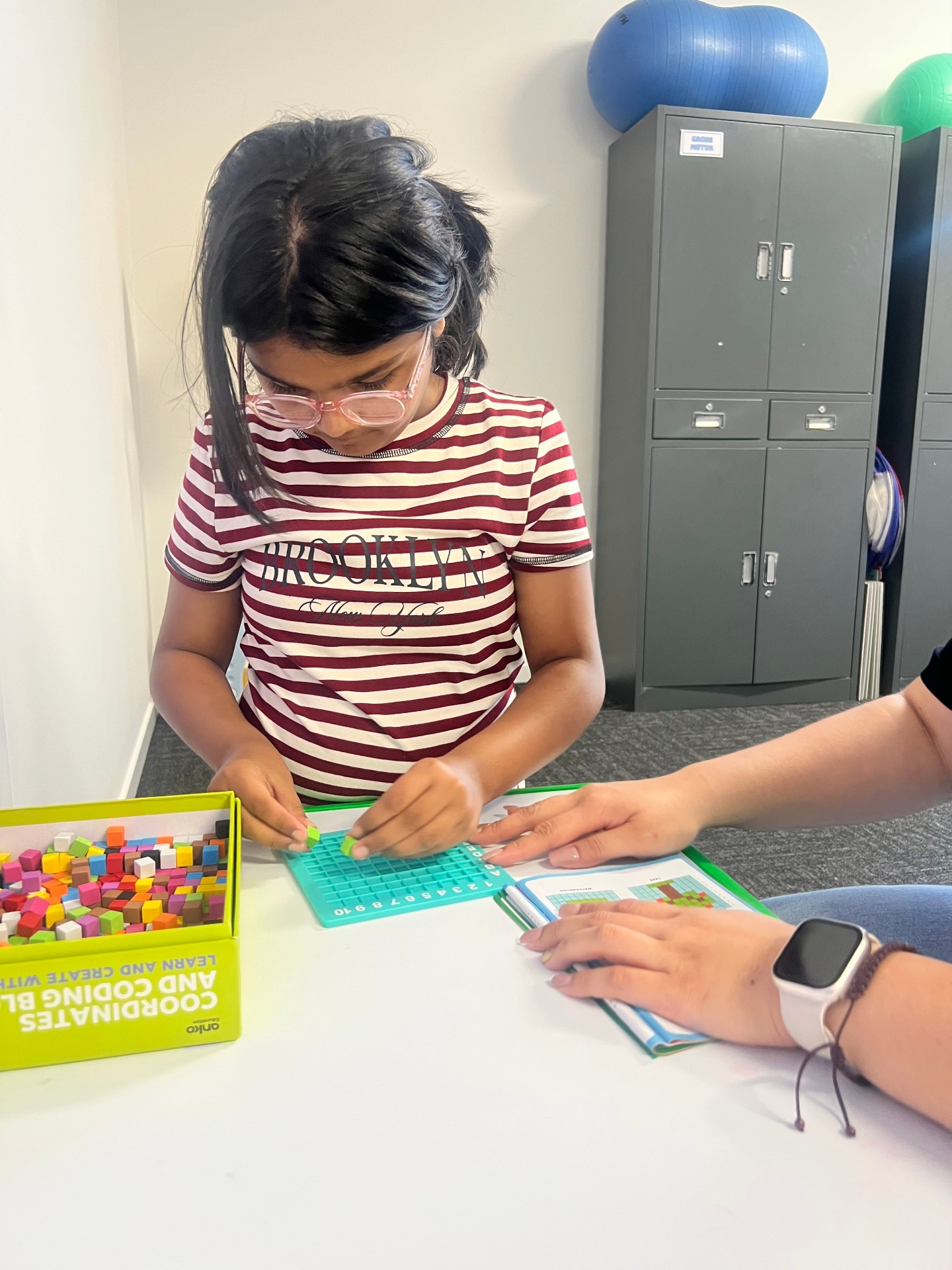 Child focused on coding block activity