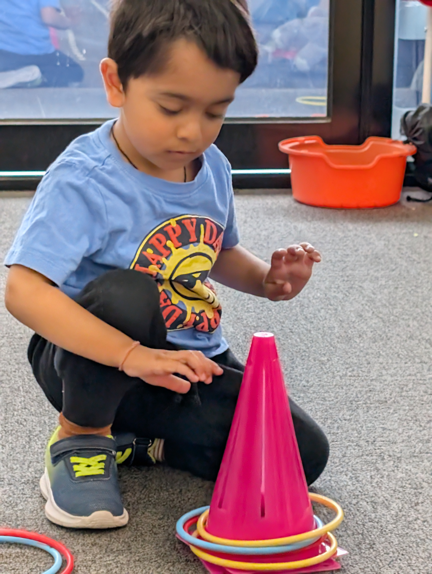 Child playing ring toss game