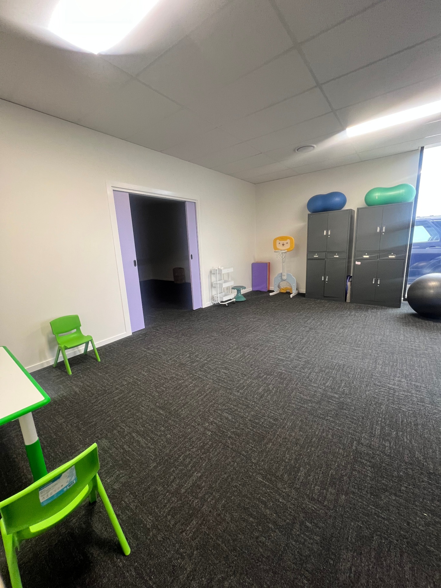 Therapy room with play equipment at Hop & Learn